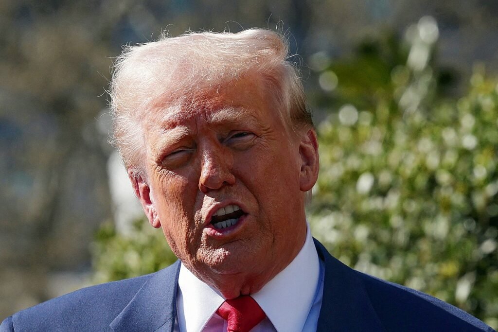 FILE PHOTO: U.S. President Donald Trump views a Tesla car at the White House in Washington